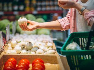 Woman buying at grocery store